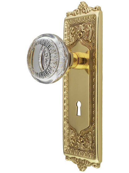 Egg and Dart Design Mortise-Lock Set with Ovolo Crystal-Glass Knobs in Un-Lacquered Brass.